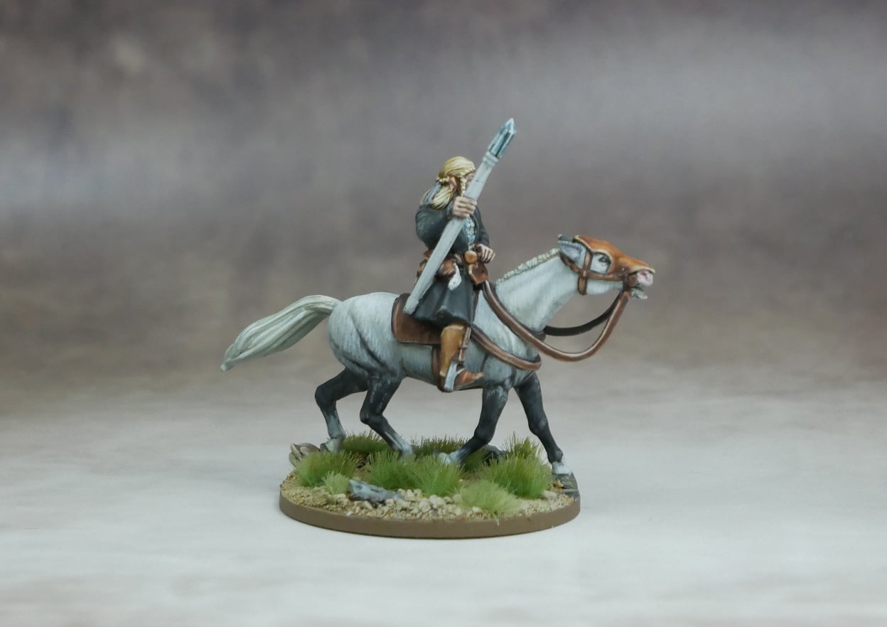 Elf High Mage riding a grey horse, wielding a staff, surrounded by natural scenery.