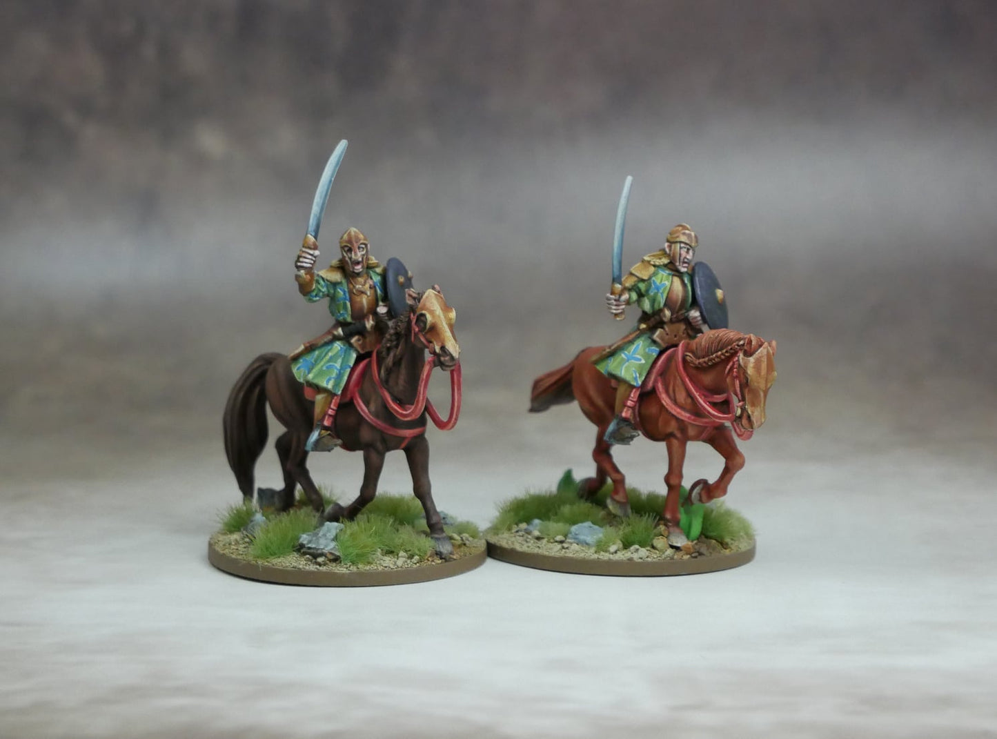 Elven Heavy Cavalry figures on horseback wielding swords, showcasing elite warrior camaraderie and tactical prowess.