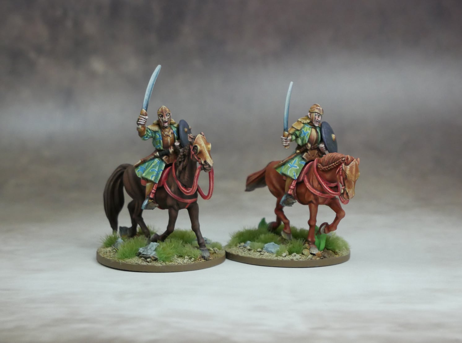 Elven Heavy Cavalry figures on horseback wielding swords, showcasing elite warrior camaraderie and tactical prowess.