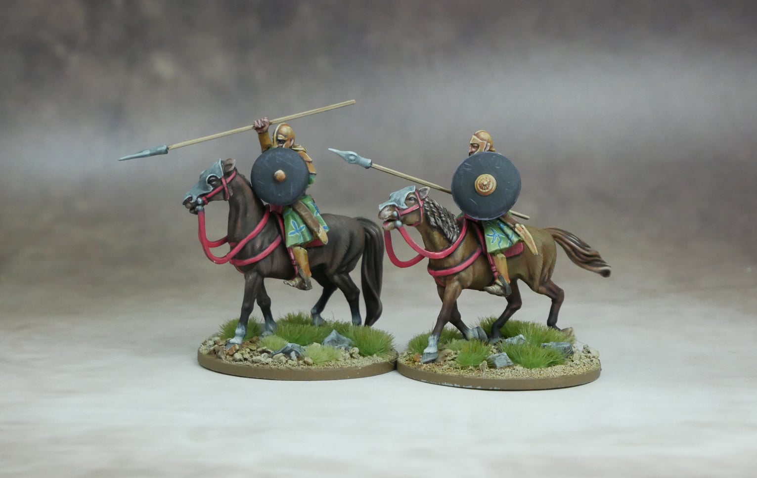 Elven Heavy Cavalry riding on horses, showcasing elite warriors with shields and spears in a dynamic pose.