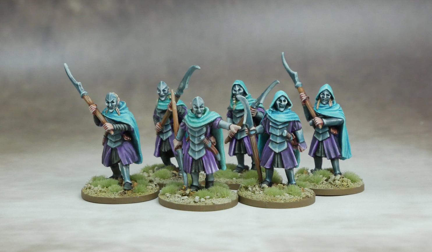 Mhanadir, Storm Mage & Elven Guardians miniature figures, showcasing six Elven guardians in cloaks with weapons.
