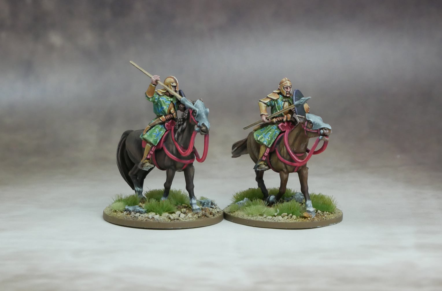 Elven Heavy Cavalry figures mounted on horses, showcasing elite warriors in battle-ready poses.