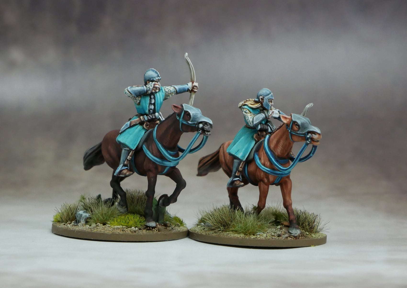Elven Light Cavalry, two elven archers on agile horses, showcasing speed and intelligence in battle.