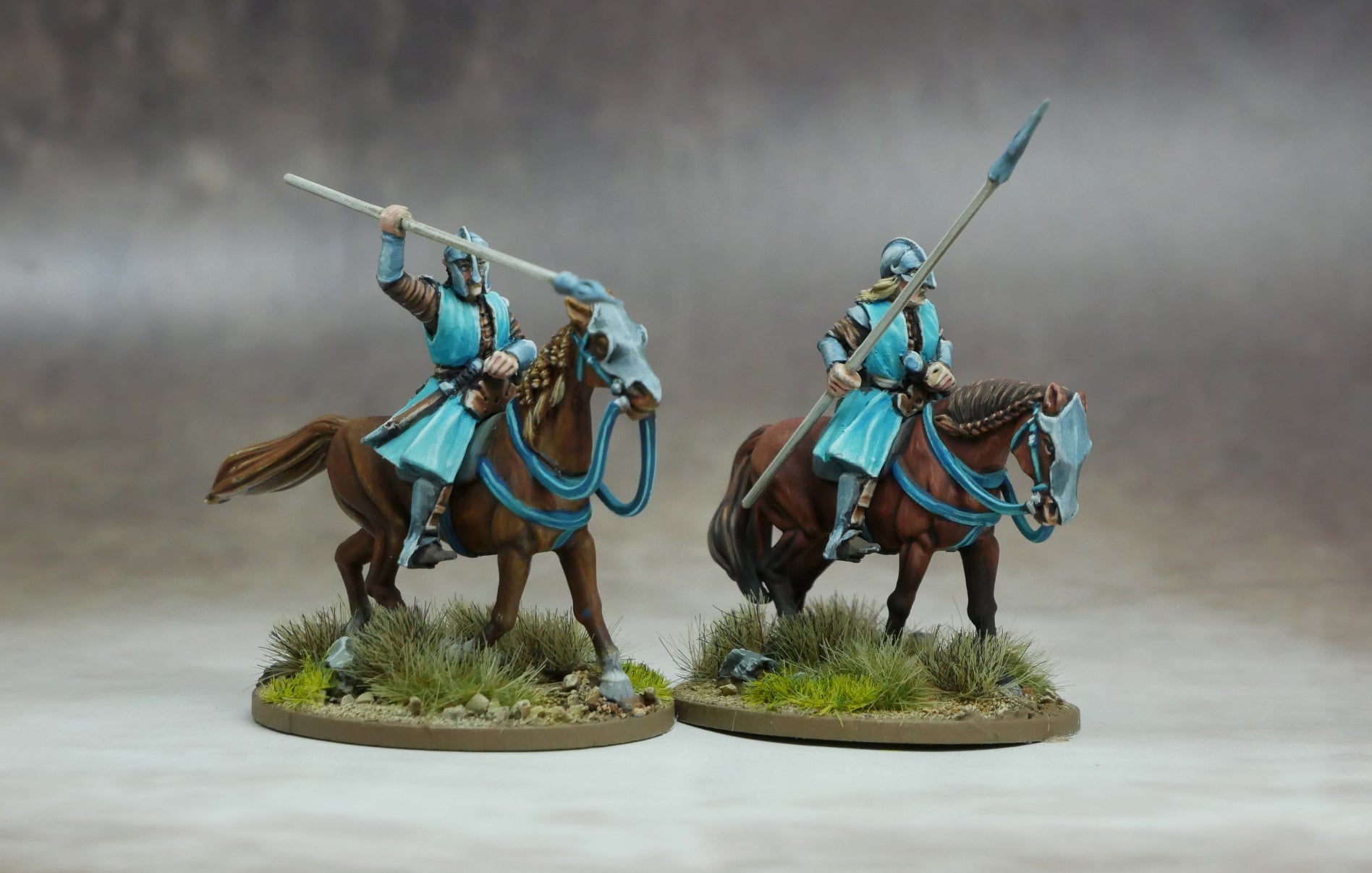 Elven Light Cavalry figures on horseback wielding spears in battle-ready poses.