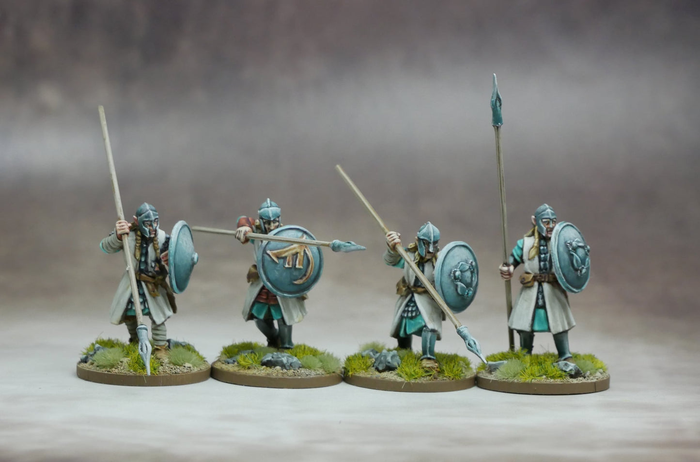Elven Warriors with Spears & Shields posed for battle, showcasing their agility and precision in combat.
