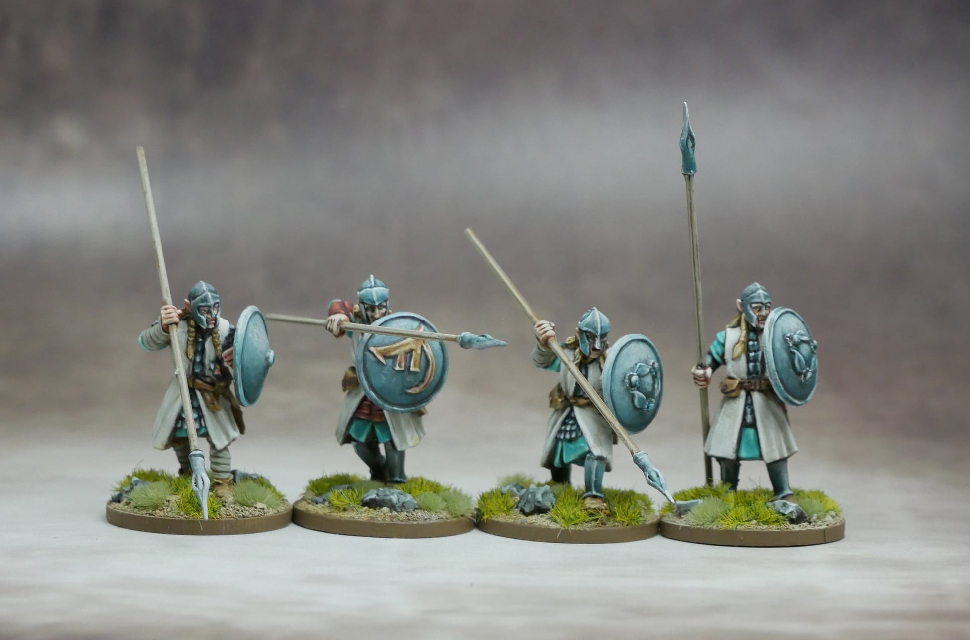 Elven Warriors with Spears & Shields posed for battle, showcasing their agility and precision in combat.