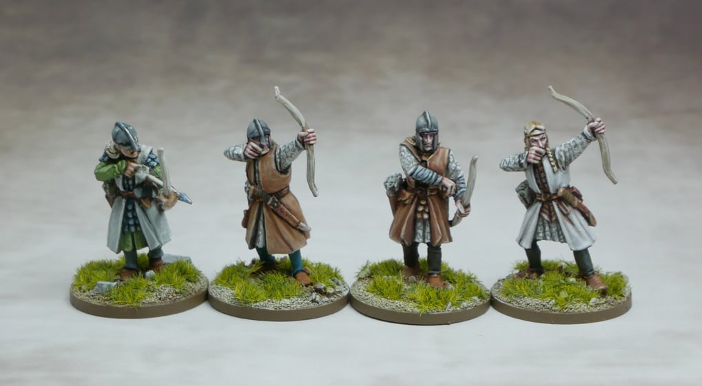 Elven Archers grouped together, showcasing detailed miniature figures with bows ready for battle.