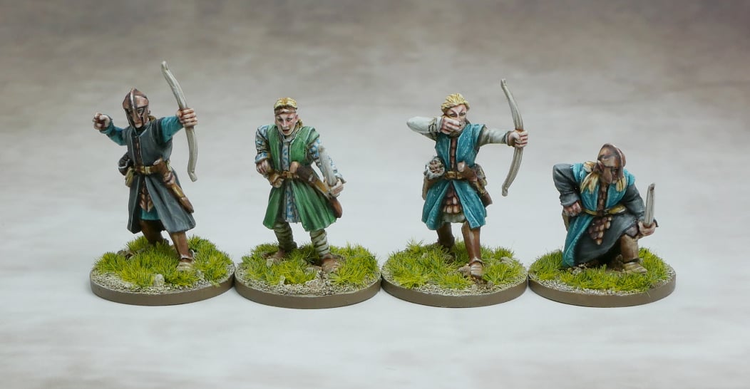 Elven Archers standing poised with their bows, crafted from moonbeam-hardened elm, ready for battle.