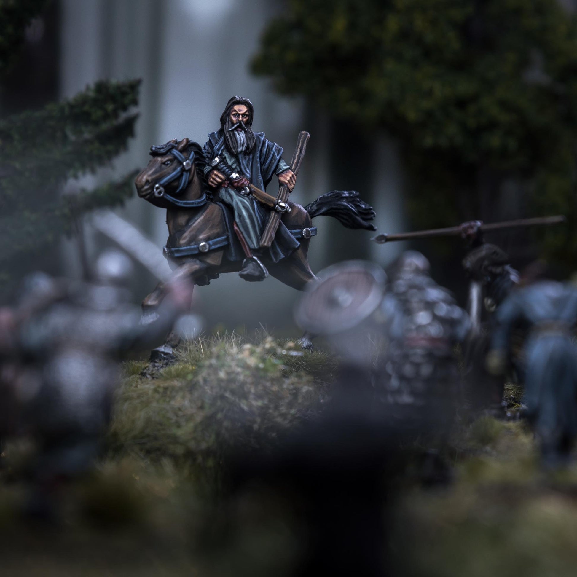 Mordrin Blackfire, the powerful human wizard, commanding a scene on horseback in an epic fantasy battle.